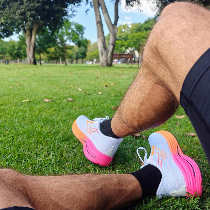 Sitting on a grass with my Mizuno daily trainer